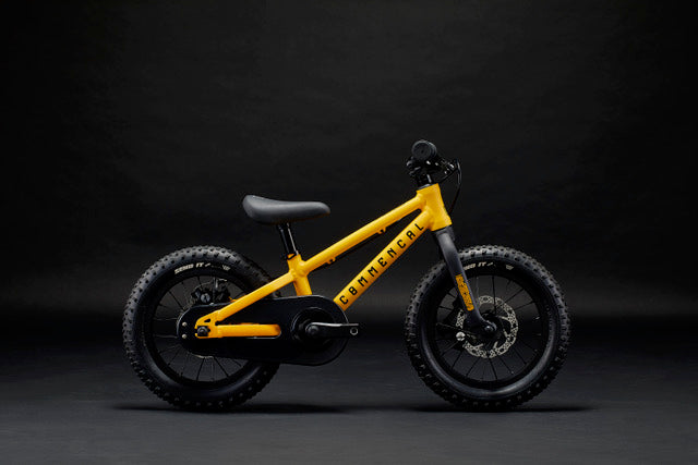 Commencal Kids Ramones 14" Mountain Bike in Ohlins View - Profile View with Dark Background