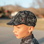 Woom FLARE Reflective Cap - Black hat on kid from side