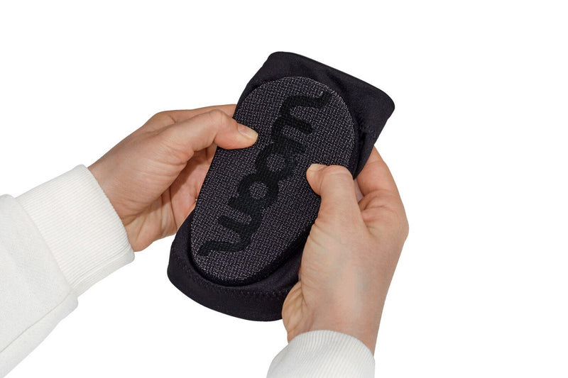 Woom NEEBOWS Elbow Pad Set - Demonstrating crash pads